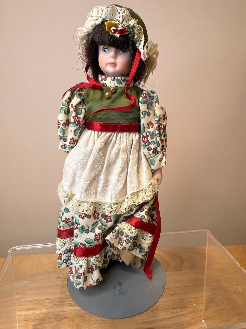 Vintage Collectible Porcelain Doll Dress with Green, Red, and Floral Patterns